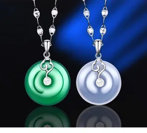 Detailed close-up of S925 silver Ruyi safety buckle pendants with green and white chalcedony.