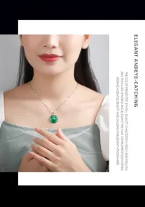 Close-up detail of green chalcedony ping ankou pendant necklace with delicate silver chain.