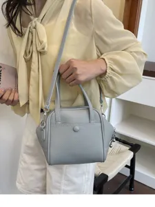 Stylish grey leather shoulder bag for women, casual tote handbag with large capacity.