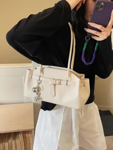 Chic beige shoulder bag for women, stylish underarm commuting handbag with belt buckle.