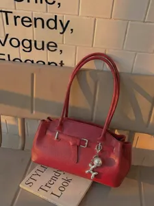 Red leather shoulder bag for women, chic stylish commuter tote handbag with metal charm.