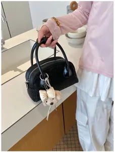 Black handbag with cute puppy keychain, stylish casual shoulder crossbody bag for women daily use.