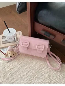 Pink vintage small square crossbody bag with double buckles and cute teddy bear pendant.