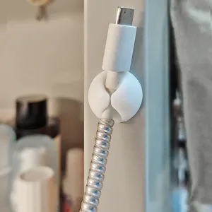 White silicone round cable clip organizer for desktop data line management and tidy wire fixing.