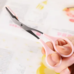 Pink eyebrow scissors with comb portable trimming makeup tool for precise shaping.