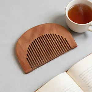 Natural wooden hair comb with wide teeth, half-circle design for daily hair care and styling.