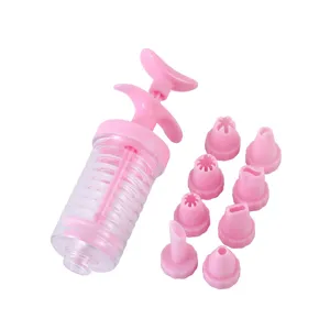 Pink plastic cookie press set with 8 piping tips, ideal for baking pastries and biscuits.
