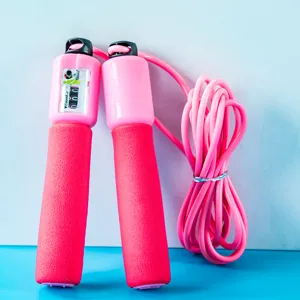 Pink fitness jump rope with mechanical counter and soft foam handles for sports and training.