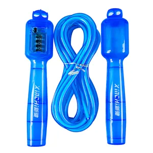 Close-up of clear blue digital counting jump rope with mechanical counter and PVC cord.