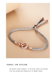 Handwoven silver rope couple bracelet with interlocking rings, adjustable design, chic everyday jewelry.