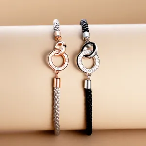 Couple braided bracelet set with interlinked silver rings and romantic engraved text design.