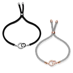 Adjustable braided couple bracelets with interlocked double rings set for daily wear.