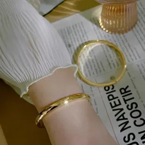 Gold titanium steel faceted bangle for women, sparkling minimalist stackable bracelet jewelry.