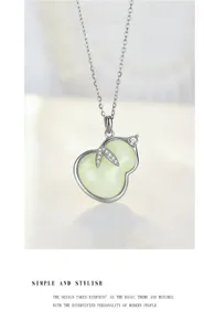 Detailed close-up shot of the elegant sterling silver and natural jade gourd pendant.