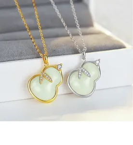 Close-up detail of S925 sterling silver natural jade gourd pendant necklace with shiny cubic zirconia.