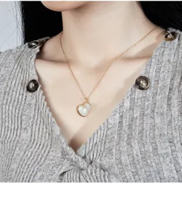 Close-up detail of the elegant jade gourd pendant necklace showcasing fine gold chain.