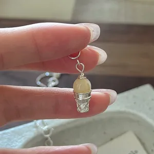 Close-up detail of a S925 sterling silver ice cream cone pendant, exquisite jewelry craft.