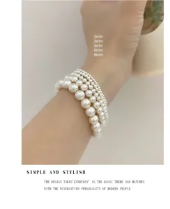 Elegantes mehrreihiges weisses Perlenarmband mit abgestuften Groessen von 2mm bis 8mm fuer Damen.