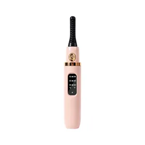 Portable electric heated eyelash curler with digital temperature display for long-lasting curl.