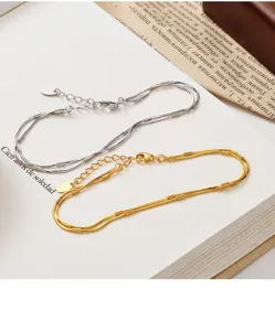 Double layer snake bone bracelet detail, sparkling star cut metal link chain jewelry.