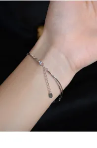 Close-up detail shot of double layer sterling silver snake chain bracelet with extension.