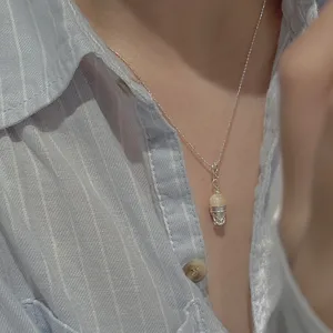 Detail shot of S925 sterling silver ice cream cone pendant necklace, minimalist Korean style.