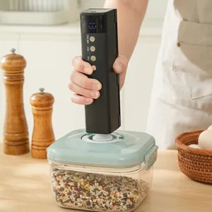 Draadloze oplaadbare vacuümmachine voor voedselcontainer, compact handapparaat.