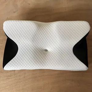 Ergonomic butterfly memory foam neck pillow, slow rebound cervical support for better sleep.