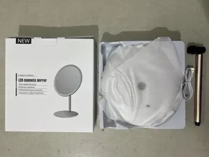 Espejo de maquillaje LED de escritorio redondo con atenuación de tres velocidades y brillo ajustable.