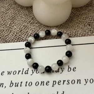 Bague elastique en perles noires et blanches vintage pour femme accessoire de mode chic