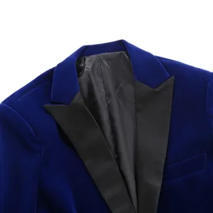 Close-up of royal blue velvet blazer with black shawl lapel, luxury men's formal suit detail.