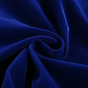 Royal blue velvet fabric detail closeup, soft plush texture and rich elegant sheen.