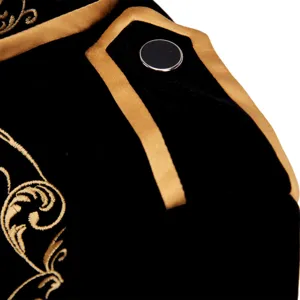 Close-up detail of mens black velvet court jacket featuring gold baroque embroidery.