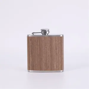Stainless steel pocket hip flask with wood grain finish, portable outdoor barware detail.
