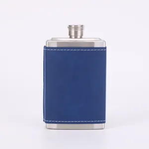 Stainless steel hip flask with blue leather wrap, portable pocket size for outdoor drinking.