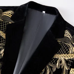 Detailed view of a black velvet suit jacket featuring exquisite gold embroidery lapel.