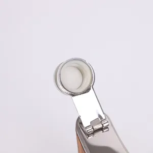 Stainless steel hip flask cap and hinge detail close up view, portable outdoor drinkware.