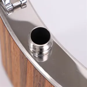 Detail view of portable stainless steel hip flask with wood grain finish and threaded spout.
