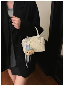 Chic Korean style women handbag PU leather white shoulder crossbody bag with cute plush keychain.