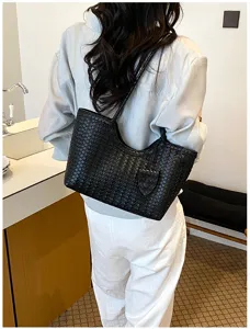 Black woven leather shoulder tote bag, stylish large capacity commuting underarm bag for women.