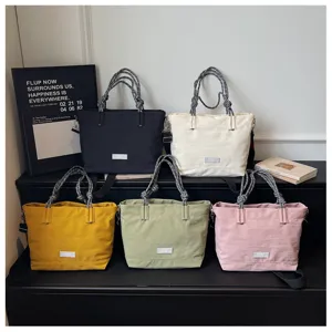 Large capacity casual canvas tote bag with braided handles, stylish commute shoulder bag.