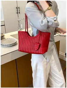 Red woven leather tote bag detailed view, perfect for daily commuting and summer casual style.