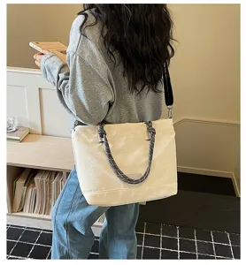 Detailed lifestyle view of casual large-capacity canvas tote bag with rope handles.
