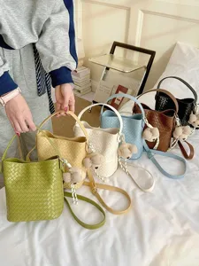 Chic woven bucket bag for women, stylish leather shoulder and crossbody handbag for daily use.