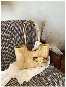 Detailed view of stylish woven tote bag in light yellow, perfect for summer casual commute use.