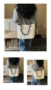 Casual large capacity canvas tote bag for women, stylish commuting shoulder crossbody bag.