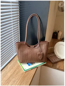 Woven brown leather tote bag detail, stylish large capacity casual shoulder handbag for commute.
