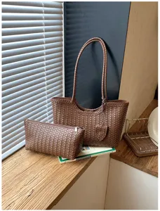 High-end woven leather tote bag with matching pouch, stylish large capacity commuter bag.