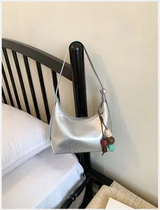 Silver hobo underarm shoulder bag with beaded charm pendant, minimal daily crossbody bag for women.
