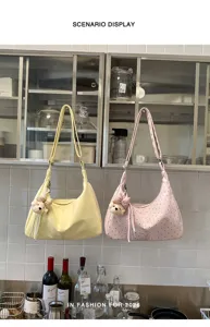 Cute polka dot shoulder bag for women, trendy underarm bag with sweet cartoon bear charm.